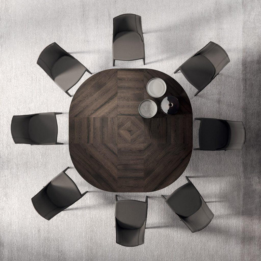 This illustration features a top-down view of a modern conference room with a round wooden table surrounded by eight black and gray chairs, ideal for business meetings and discussions.