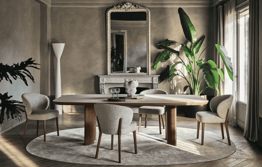 Elegant dining space featuring the CS2243 Mara Dining Chair by Calligaris with wood legs, paired with a large oval wood table and classic decor.