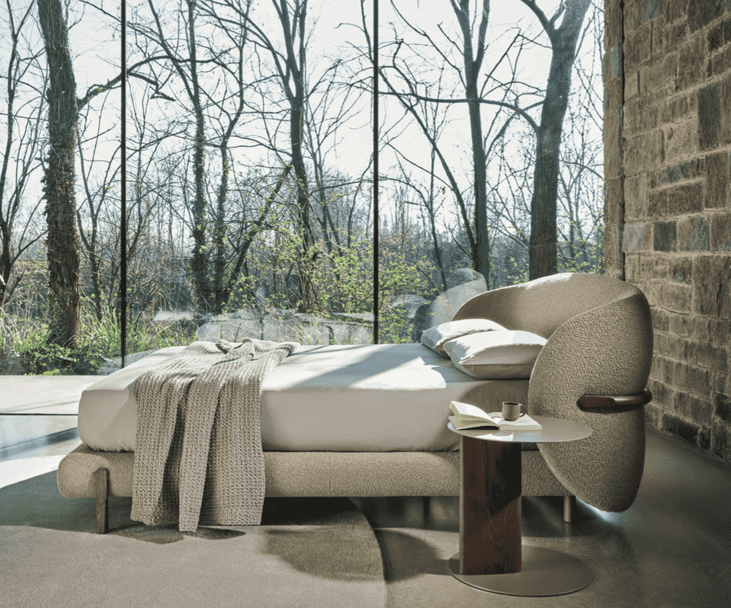 Full view of the CS6218 Oleandro Bed by Calligaris Italy in a modern bedroom with floor-to-ceiling windows, featuring elegant curves and soft textures.