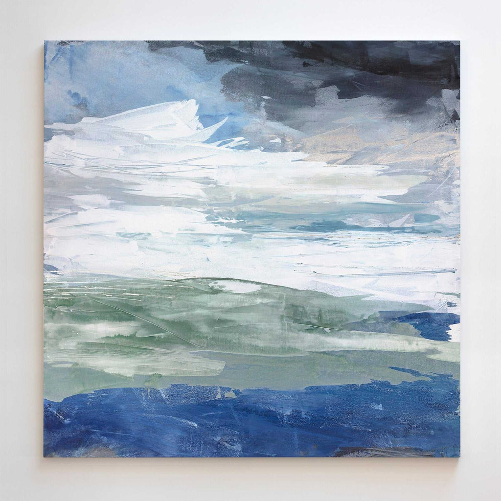 Close-up of a large abstract watercolor canvas print featuring layered blue, white, and dark gray tones, textured surface