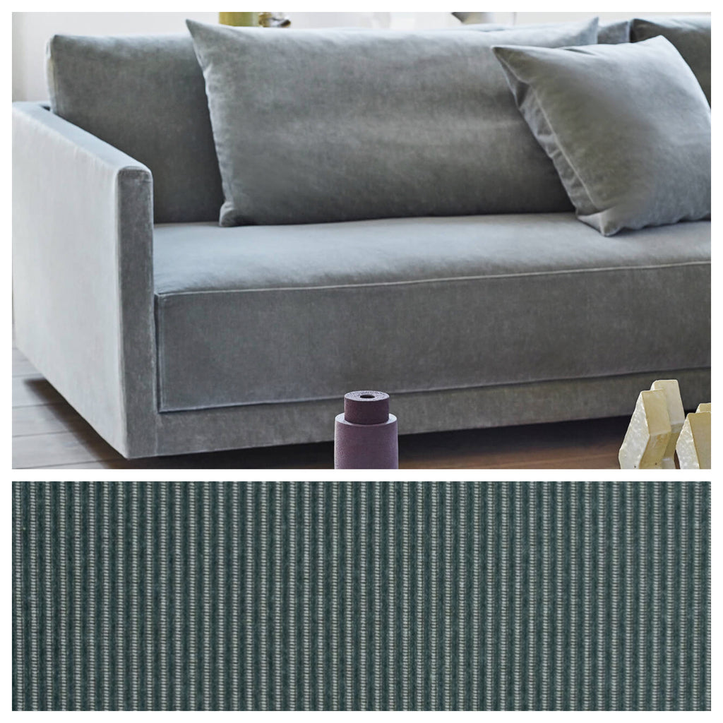 Detail of Eilersen Drop Sofa in blue fabric with Munster 04 swatch, highlighting texture and color of upholstery.