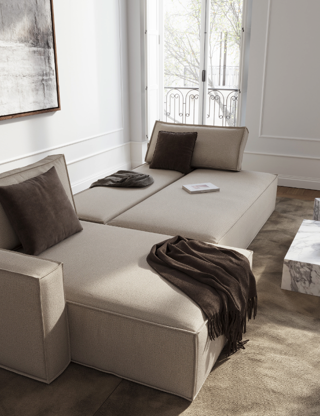 Minimalist beige sofa bed with brown pillows and throw, placed near a window with natural light, contemporary interior design