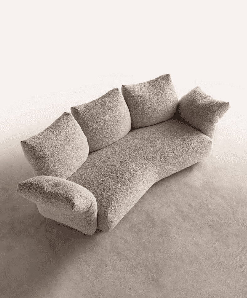 Minimalist beige sofa with textured fabric and three cushions, designed by Art Nova, placed on a light-colored floor for modern decor