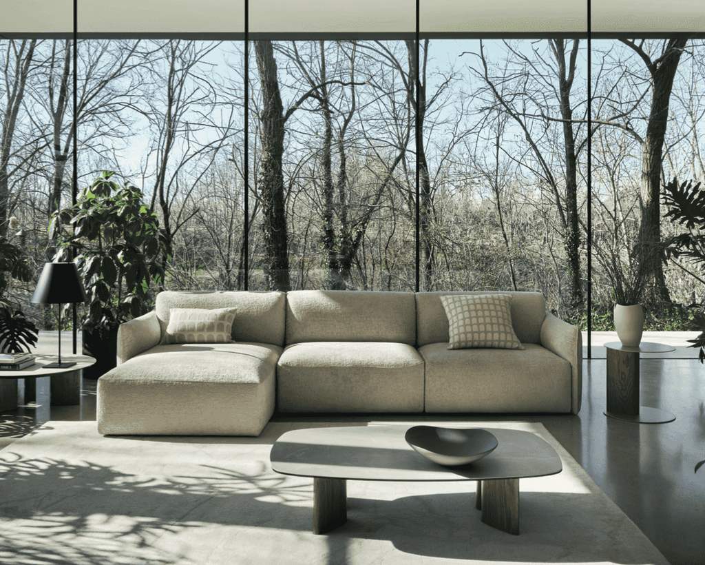 Full view of CS3469 Axis Low Sofa by Calligaris in a spacious modern interior, paired with minimalist coffee table and large windows.