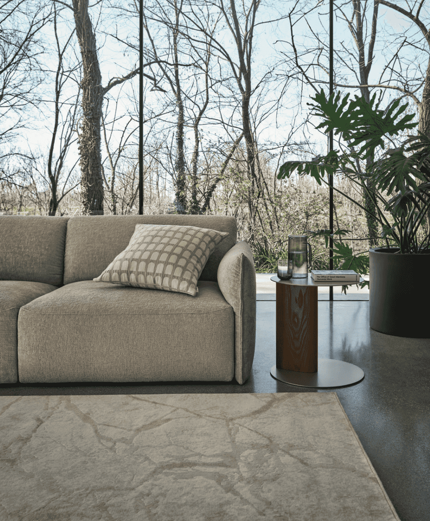 CS3469 Axis Low Sofa by Calligaris in a modern living room with floor-to-ceiling windows, styled with neutral tones and contemporary decor.