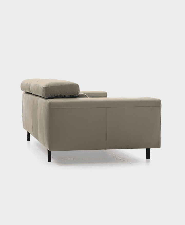 Rear angle of CS346 Edgar Sofa in beige leather, displaying its structured back and minimalist black legs for a sleek profile.