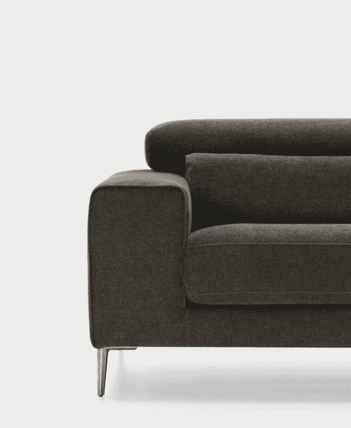 Detail view of CS346 Edgar Sofa in dark fabric with chrome legs, emphasizing its plush cushions and refined craftsmanship.
