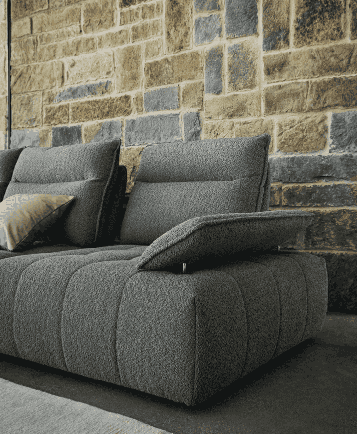 Angled view of CS3467 Equipe Sofa by Calligaris with raised backrests and armrests, emphasizing ergonomic sectional design.