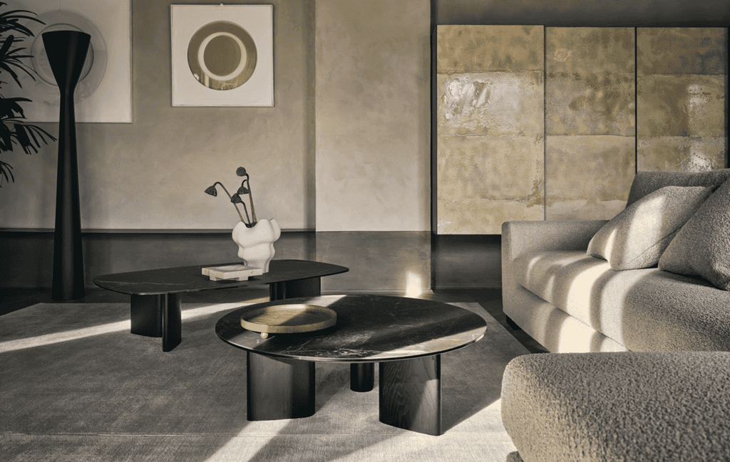 CS348 Sierra Sofa by Calligaris paired with modern black coffee tables. Italian sectional sofa enhances minimalist living room with cozy elegance.