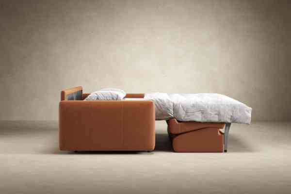 Side view of Innovation Living Carnell Leather Sleeper Sofa Bed in bed position, illustrating its compact and functional transformation.