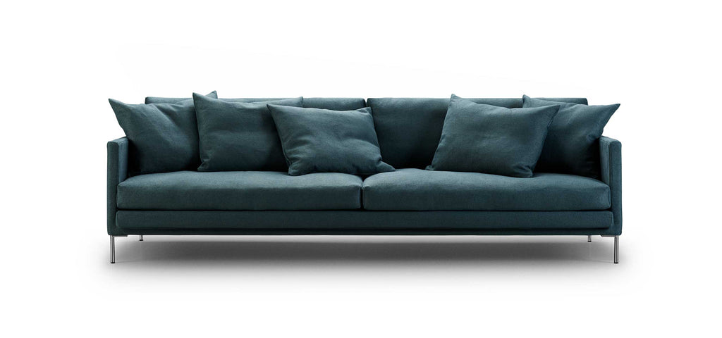 Front view of Ash Sofa by Eilersen in teal fabric with multiple back cushions, designed for comfort and style at Trade Source Furniture.