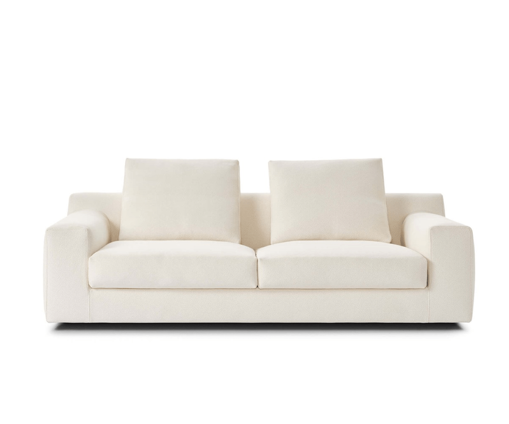 Straight-on view of the Aton Mini Sofa by Eilersen in white, emphasizing its symmetrical design and soft comfort. A compact luxury sofa for elegant homes.