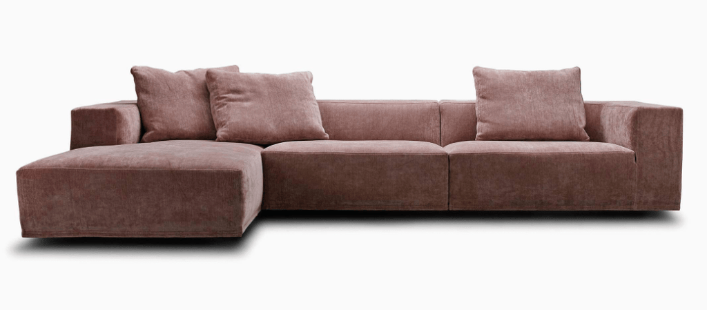 Front view of the Eilersen Baseline Sofa with Chaise in rose pink fabric, featuring three large back cushions and low-profile design.