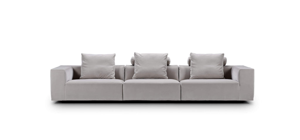 Straight-on view of the Eilersen Baseline Sofa in light grey, featuring three back cushions and clean-lined armrests for modern interiors.