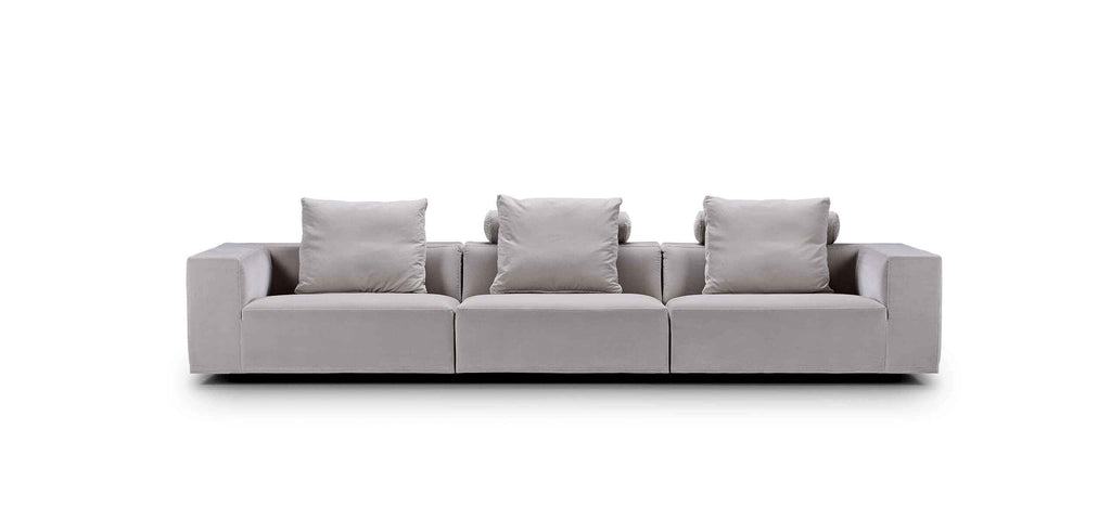 Straight-on view of the Eilersen Baseline Sofa in light grey, featuring three back cushions and clean-lined armrests for modern interiors.