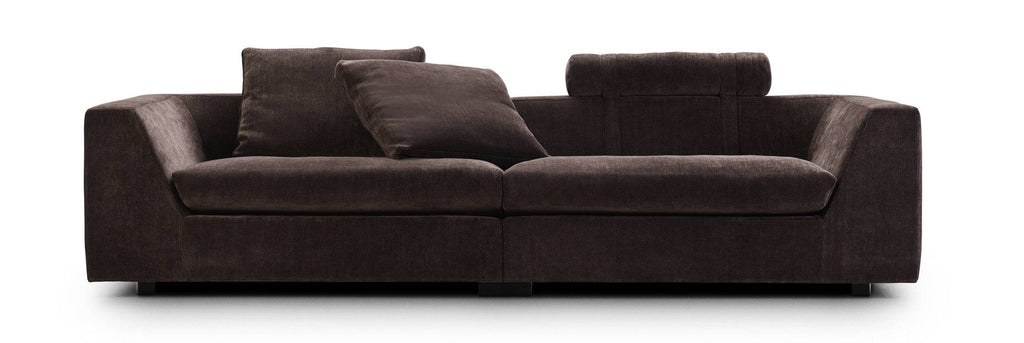 Chess Sofa by Eilersen in light beige fabric with two large cushions and cylindrical headrests, perfect for minimalist decor.