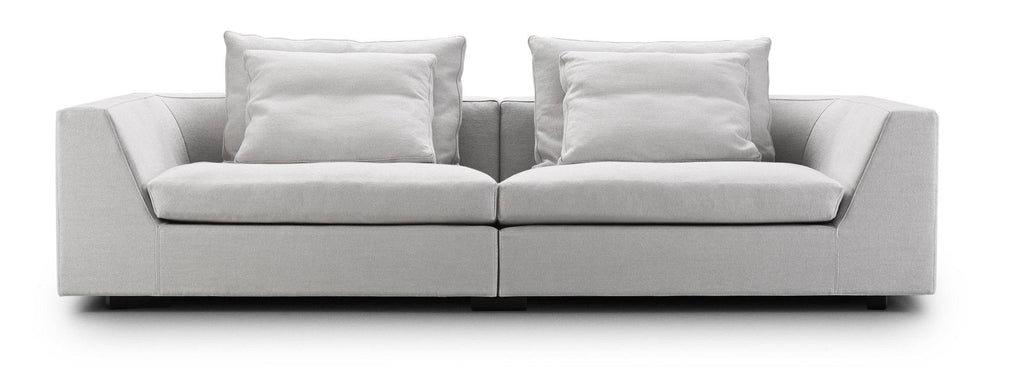 Chess Sofa by Eilersen in dark green fabric with left-facing chaise and headrest, designed for comfort and modern aesthetics.