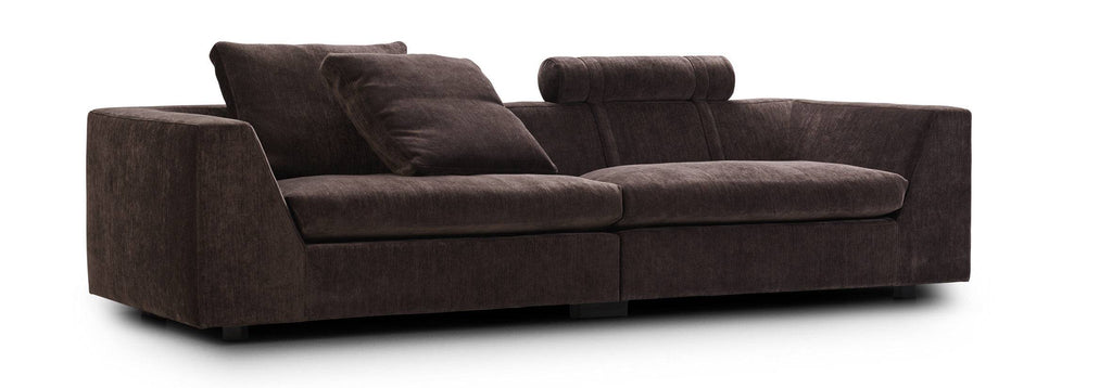 Chess Sofa by Eilersen in dark brown fabric with headrest and asymmetrical cushion layout, ideal for cozy interiors.