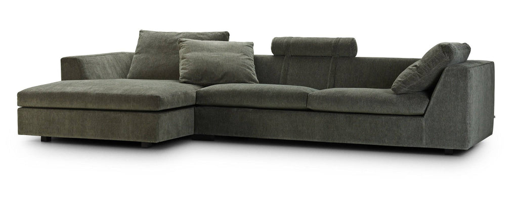 Chess Sofa by Eilersen in light beige fabric with two large cushions and cylindrical headrests, ideal for modern interiors.