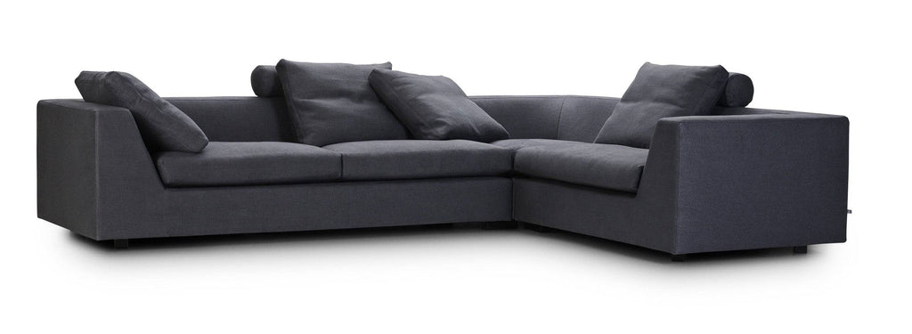 Chess Sofa by Eilersen in mustard yellow fabric with three cushions, offering a bold color option for contemporary spaces.