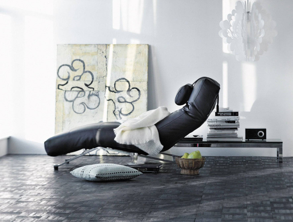 Eilersen Control Chair in black leather with headrest, styled in a cozy modern room, part of the quick ship collection at Trade Source Furniture.