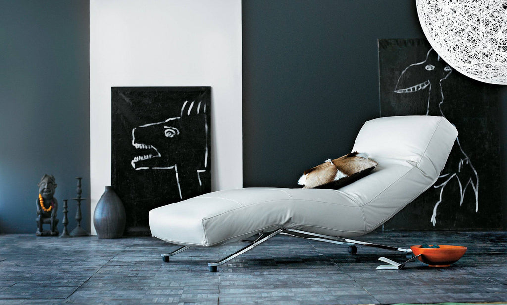 Eilersen Control Chair in white leather, styled in a contemporary room with black art decor, available at Trade Source Furniture.