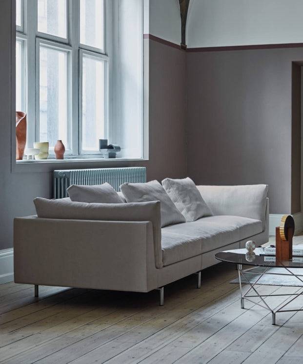 Side view of Float High Sectional Sofa by Eilersen in a modern room with natural lighting and neutral-toned furnishings.