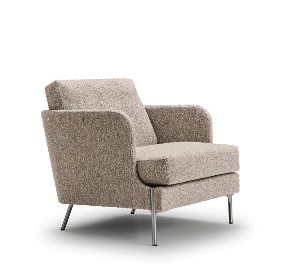 Funen Lounge Chair by Eilersen in beige boucle fabric with chrome legs, offering cozy seating and contemporary elegance.