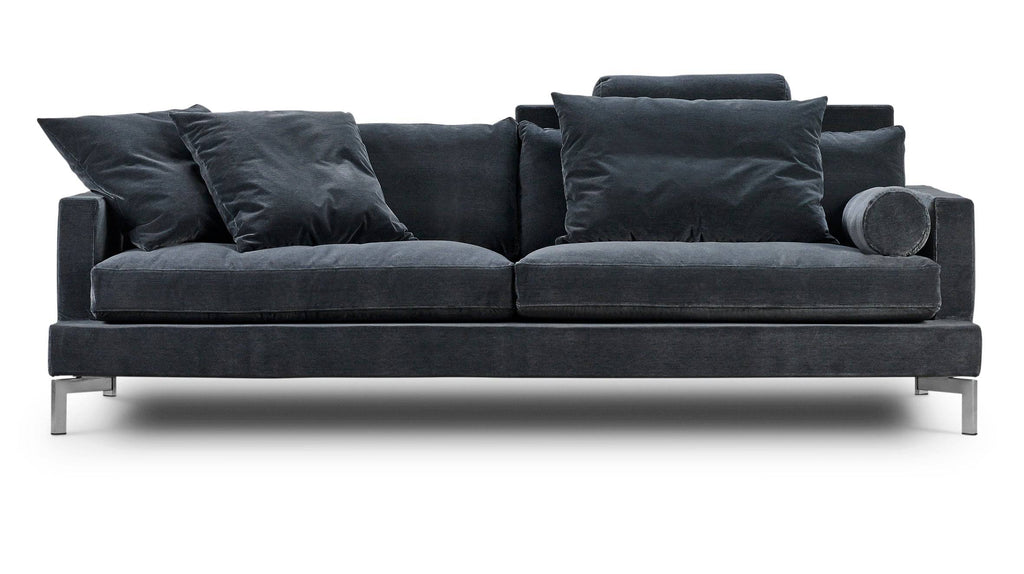 The Great Lift Sofa by Eilersen at Trade Source Furniture in deep charcoal, styled with oversized cushions and sleek metal legs.