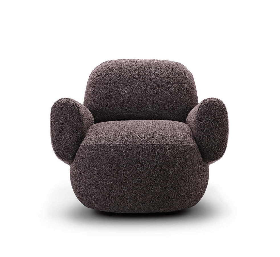 Front view of Havana Round Arm Chair by Eilersen in dark boucle, highlighting its plush and rounded silhouette.