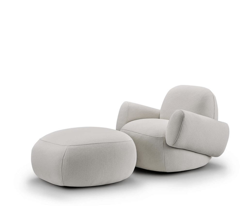 Havana Round Arm Chair and ottoman by Eilersen in light boucle, shown together for a coordinated lounge furniture set.