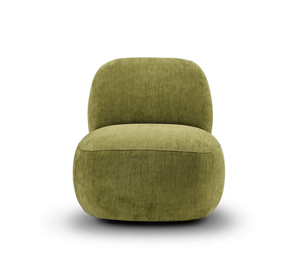 Side view of Havana Lounge Chair by Eilersen in vibrant yellow-green velvet, showcasing its sculptural form.
