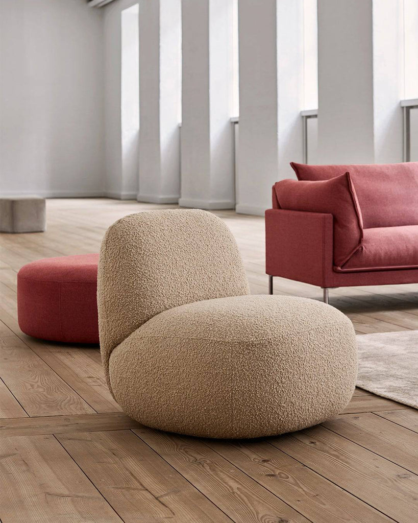 Havana Round Arm Chair by Eilersen in beige boucle fabric, styled in a modern living room with wood flooring and minimalist decor.