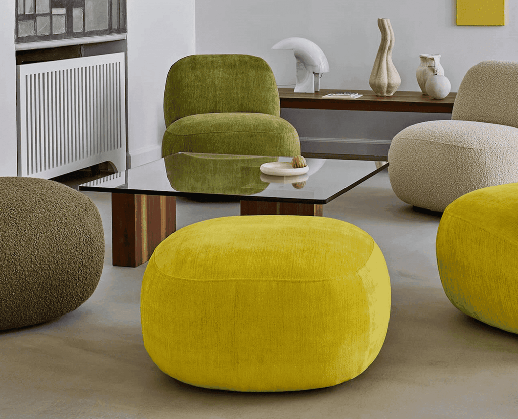 Front view of Havana Round Arm Chair by Eilersen in textured beige boucle, offering plush comfort and modern style.