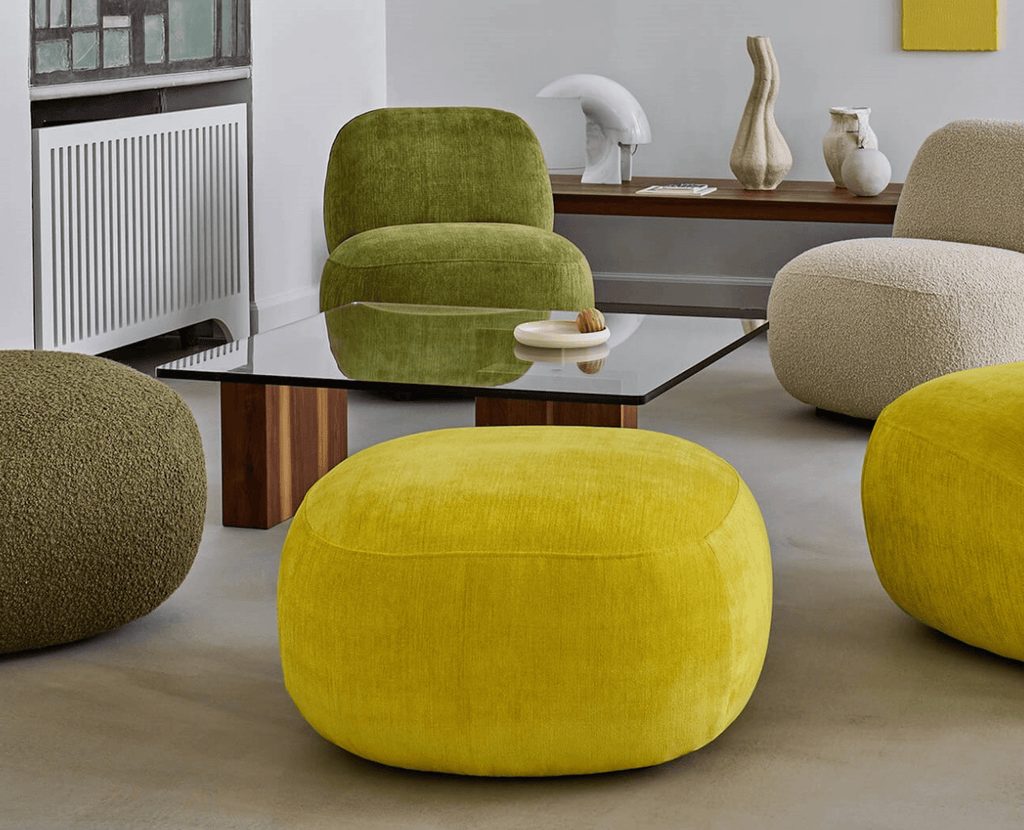 Front view of Havana Round Arm Chair by Eilersen in textured beige boucle, offering plush comfort and modern style.