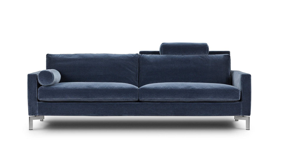 Front view of the Quick Ship Lift Sofa by Eilersen in blue velvet, showcasing its elegant design and comfort-focused features.