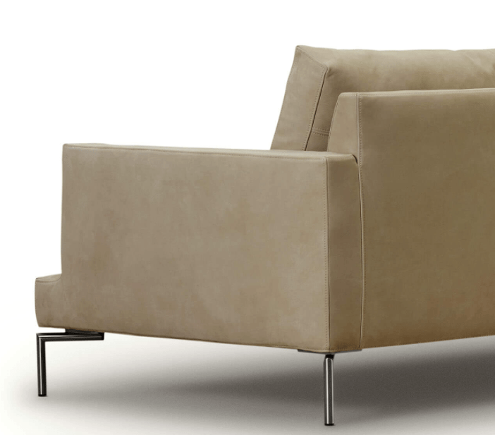 Close-up of the beige Loft Sofa by Eilersen highlighting armrest stitching and slim metal legs, perfect for luxury modern interiors.