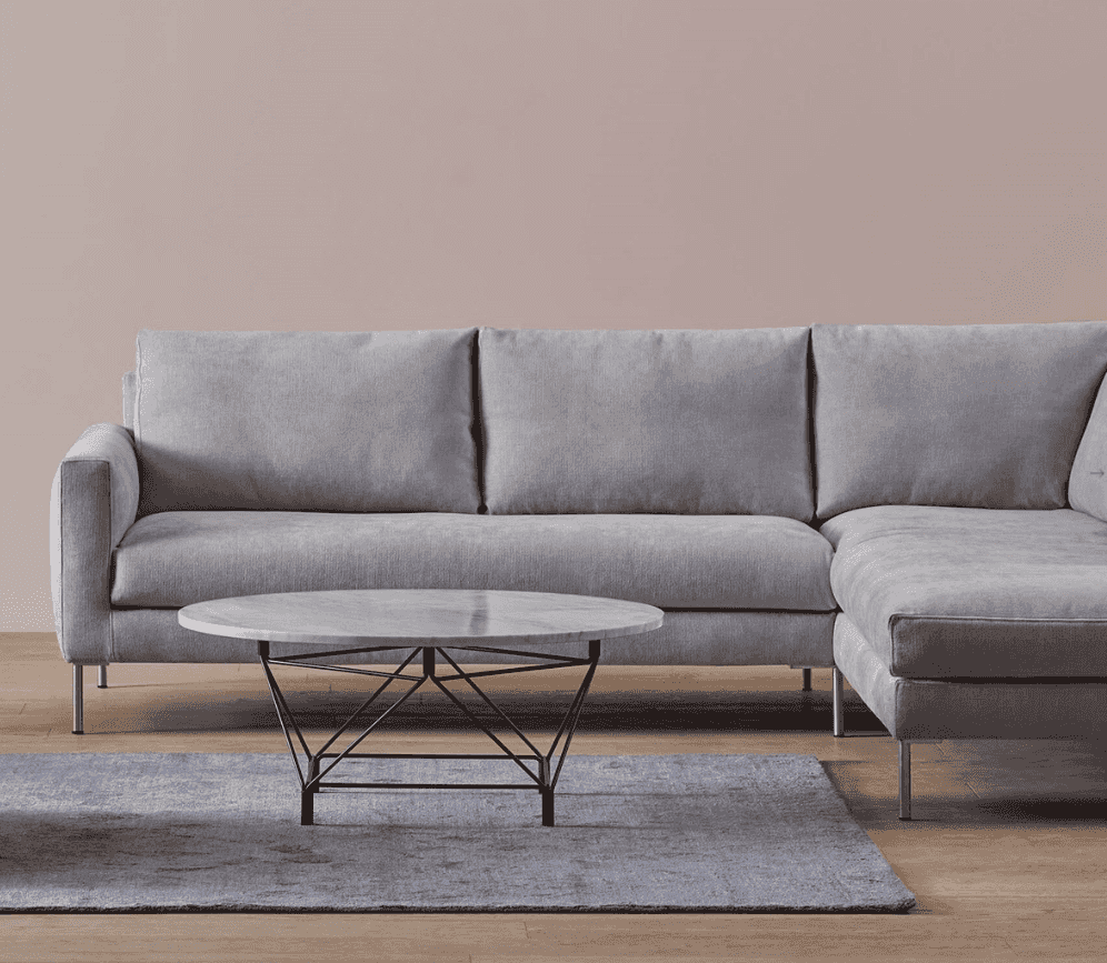 Luce Sofa by Eilersen in light grey fabric with right-facing chaise, featuring minimalist Scandinavian design in modern living room setup.