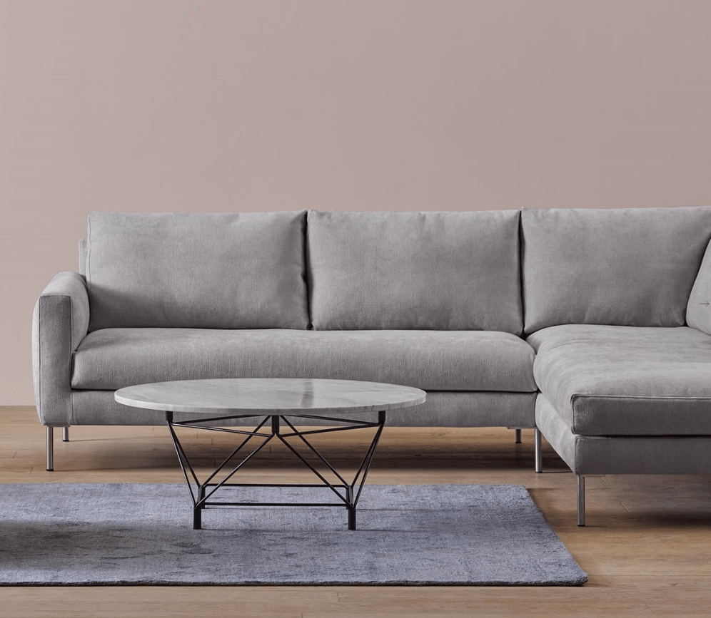 Luce Sofa by Eilersen in light grey fabric with right-facing chaise, featuring minimalist Scandinavian design in modern living room setup.