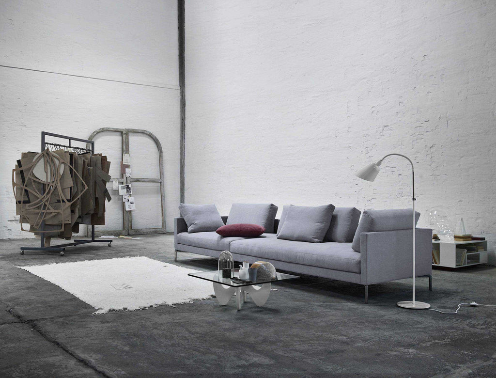 Eilersen Plano Sectional Sofa in a loft-style space with industrial decor and minimalist furniture, upholstered in Herring 07.