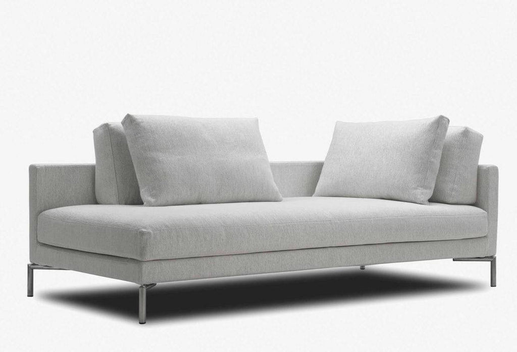 Compact version of Eilersen Plano Sofa in light grey fabric, featuring slim metal legs and plush cushions for modern interiors.