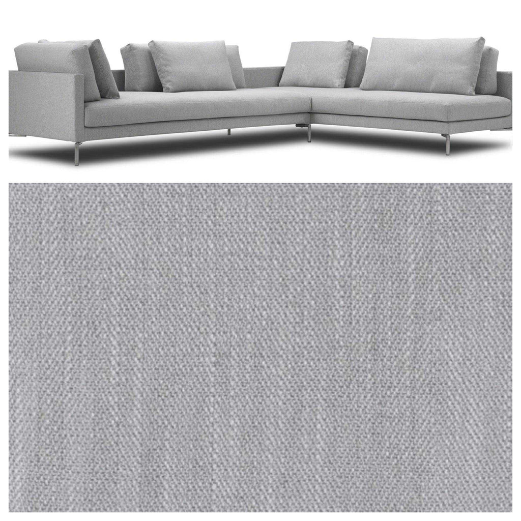 Close-up of Eilersen Plano Sectional Sofa with fabric swatch in Herring 07, highlighting texture and upholstery detail.