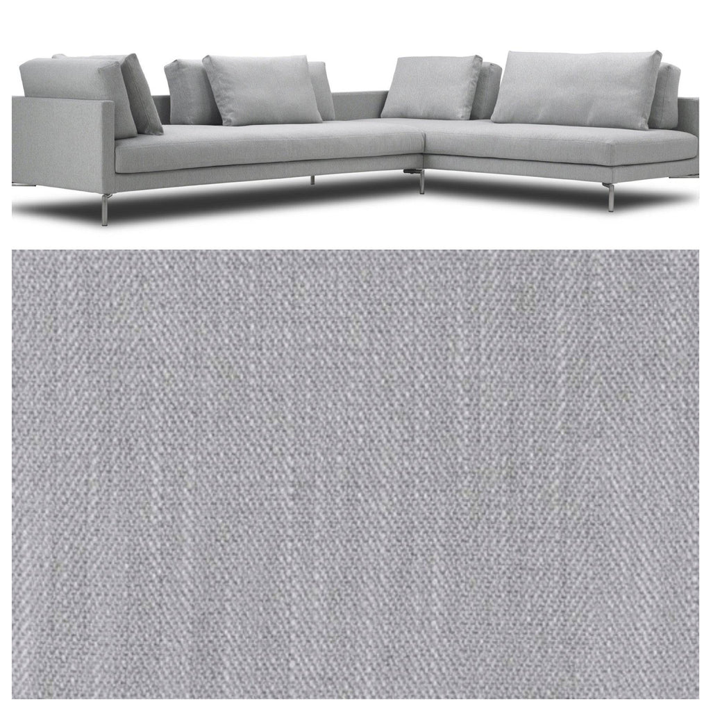 Close-up of Eilersen Plano Sectional Sofa with fabric swatch in Herring 07, highlighting texture and upholstery detail.