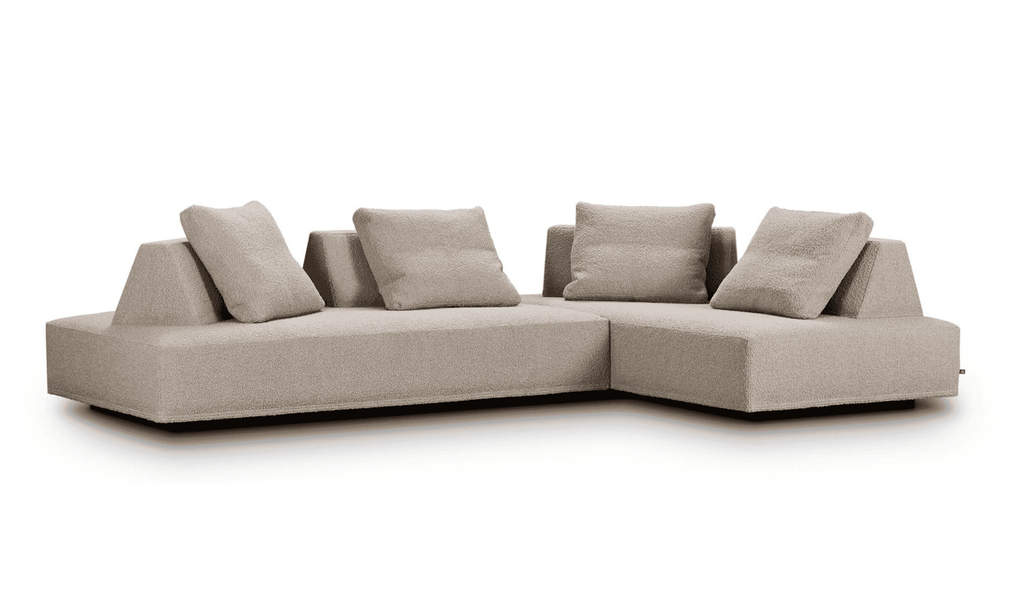 Corner configuration of Eilersen Playground Sofa in light beige fabric, featuring modular design and movable backrests.