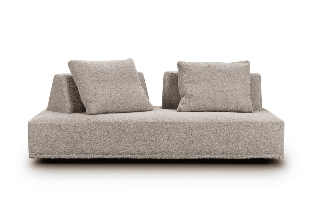 Front view of Eilersen Playground Sofa in beige boucle, highlighting its double-sided seating and plush cushions.