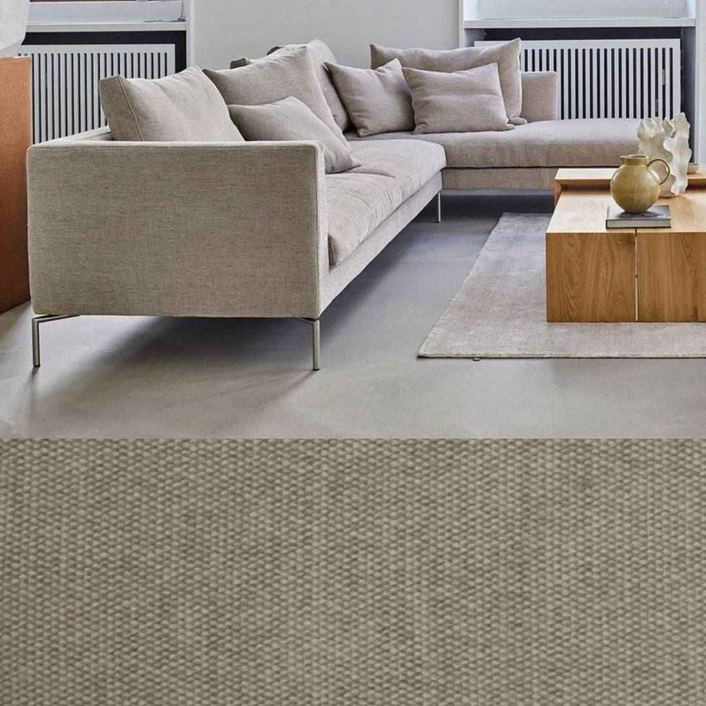 Close-up of the Ra Sectional by Eilersen in Level 0026 fabric, highlighting its textured upholstery and sleek metal legs.