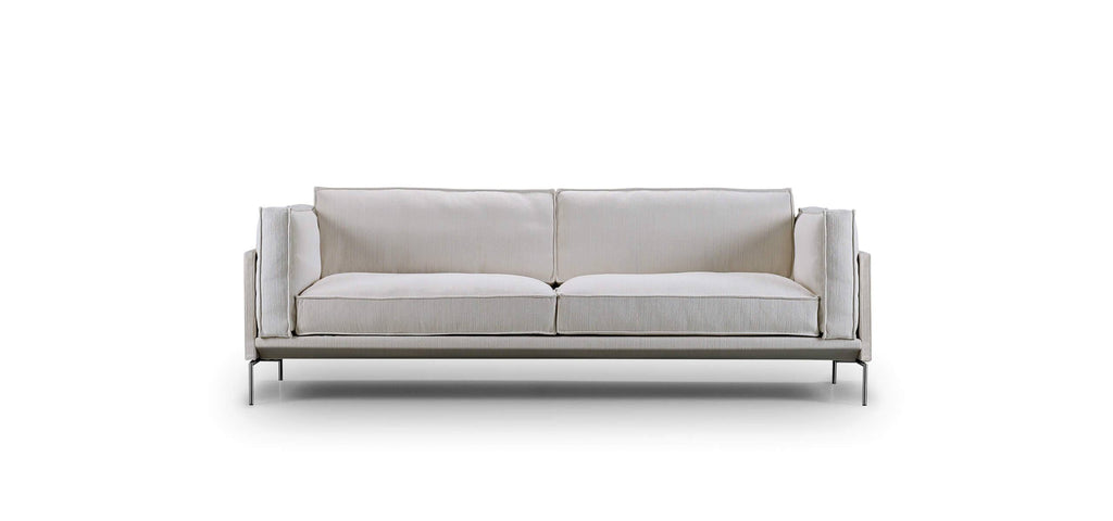 Front view of Slimline Sofa by Eilersen in light neutral fabric with sleek metal legs, ideal for modern furniture collections.
