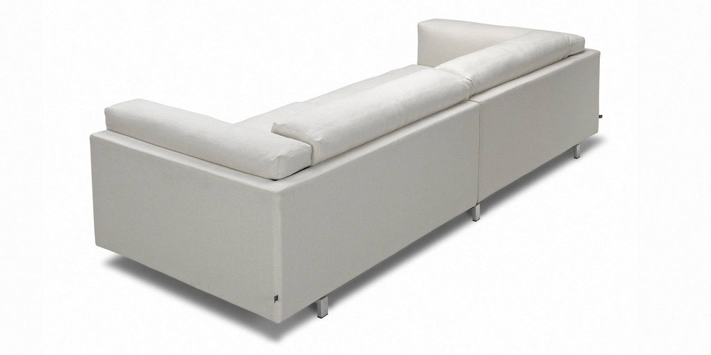 Rear view of the Eilersen Tub Sofa in white fabric, showing its clean lines and modern silhouette.