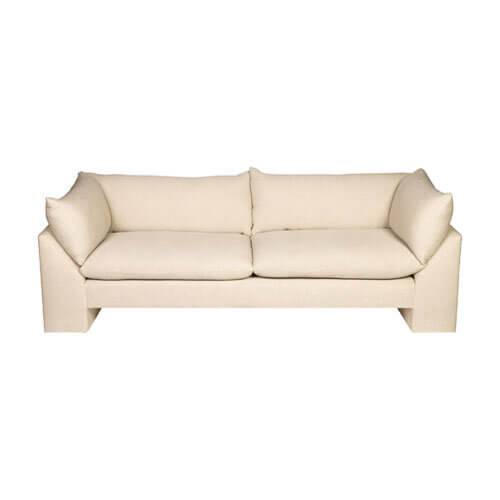 Cream-colored upholstered sofa with clean lines and soft cushions, perfect for contemporary living spaces, shown in a neutral tone