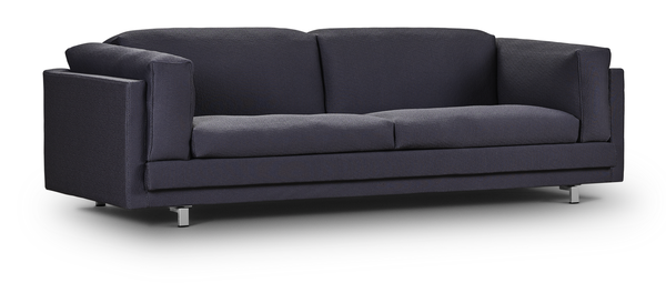 Angled view of the Tub Sofa by Eilersen in Plindy 16 fabric, showcasing its bold structure and soft upholstery.